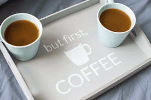 Make mornings more fun with an easy-to-make tray for your daily cup of coffee. Using chalk paint, a silhouette stencil, and an unfinished wooden tray from any craft store!