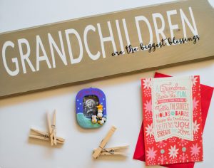 Every year my parents would give us Hallmark Ornaments on Christmas Eve. This year I'm turning it around and giving my parents a Hallmark Ornament from their Grandchild, and made a cute plaque display with my Silhouette Portrait for them to show off their gift! #SendHallmark [ad]
