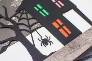 Spooky Halloween Frame - I hate the scary aspect of Halloween so I typically don't decorate for the holiday. But I found the perfect non-scary Silhouette file and paired it with my paper banner to create a fun Halloween decoration that's more cute than spooky!