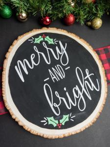 Merry and Bright Christmas Sign - I love saving room and money on Christmas decorations and reversible signs are the perfect way to do both! Using your cutting machine you can repurpose old holiday decor with a new rustic and minimalist design! Free SVG + PNG + DXF file included so you can make one too.