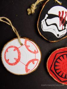 Star Wars Ornaments - Make your own rustic Star Wars Ornaments with wood slices, DecoArt paint, and your Silhouette machine! This simple + quick DIY is perfect for the Star Wars fans in your life!